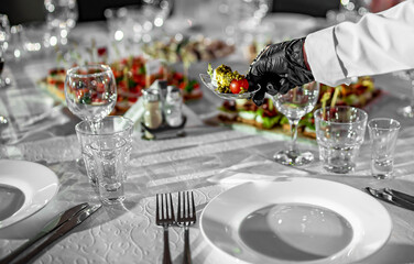 waiter holds food. Restaurant service. buffet or catering.