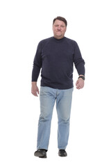 Fototapeta premium Mature man in jeans striding forward.isolated on a white background.