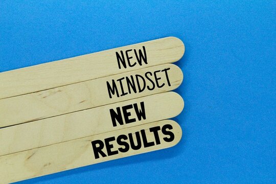 wooden ice cream sticks with the words new mindset new results