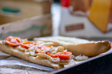 Close Up Close up of Baguette with Aubergines in Oil and Sliced Tomatoes at the Italian Market