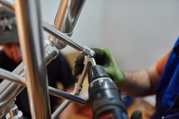 Close up photo of installation of aluminum fence. Selective focus