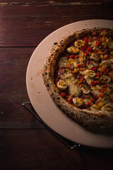 Delicious Pizza Burger Classic Homemade Tomato Sauce Sausage Cheese Onion Chicken Meat Pasta Shrimp Restaurant Menu Gourmet on a wooden table