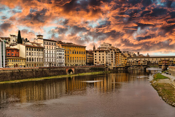 sunset in the town of florence with bridge