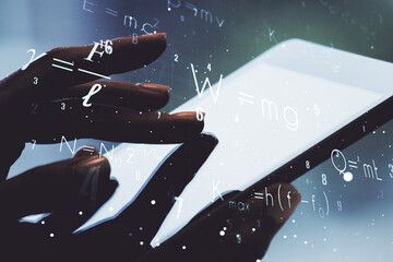 Creative scientific formula concept with finger clicks on a digital tablet on background....