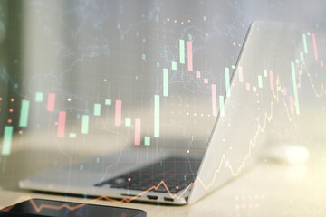 Multi exposure of abstract financial graph with world map on modern computer background, financial and trading concept
