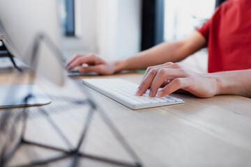 cropped view of manager using computer keyboard in office.