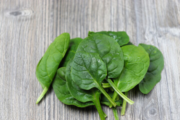 fresh spinach on  a wooden rustic table