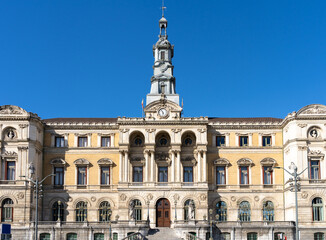 Fototapeta na wymiar Facade of Bilbao city hall building on sunny day built in 1892