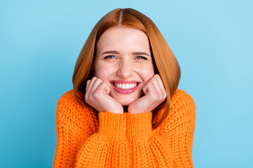 Photo of young sweet orange hairdo lady hands face wear sweater isolated on blue color background