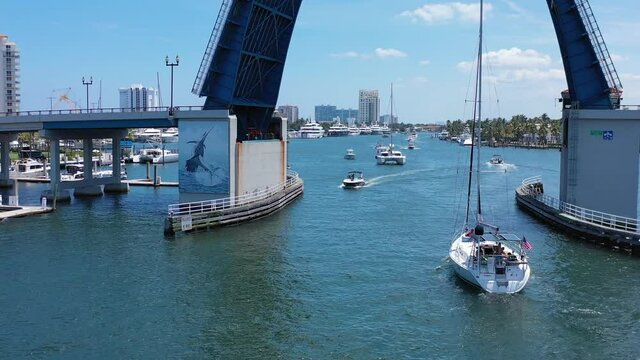 Sailboat going under drawbridge in Ft Lauderdale Florida canal