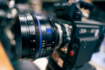 Digital Cinema camera and Cinema Lens. Manual interchangeable lens for filming. Shooting in the...