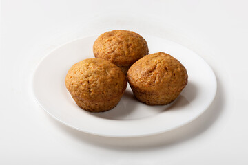Carrot sweet muffins. Carrot cupcakes with sugar on a white background for insulation
