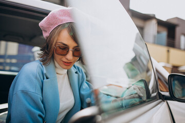 Young woman travelling by electro car