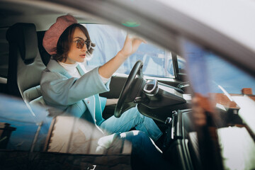 Young woman travelling by electro car