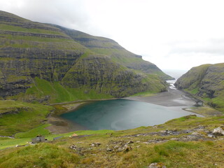 Fototapeta na wymiar The beautiful Atlantic coastline and islets on the Faroe Islands