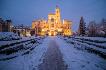 Famous castle Hluboka nad Vltavou in the Czech Republic in winter in the evening