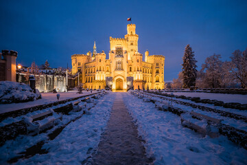 Famous castle Hluboka nad Vltavou in the Czech Republic in winter in the evening