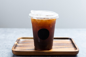 Iced americano in plastic cup.