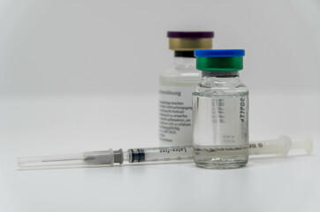 syringe and vials, concept image for vaccine