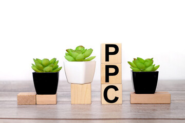 PPC - Pay Per Click concept Business. text on wooden boards on a white background on a wooden table