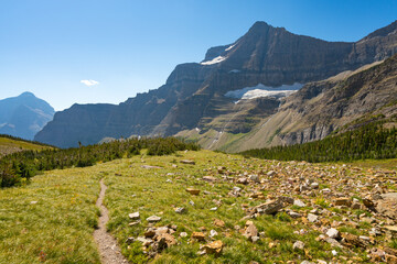 Matahpi Peak and valley below viewed from Siyeh Pass hiking trail, Glacier National Park, Montana....