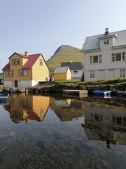 Obraz premium The cute and cozy old historical houses of the Faroe Islands with grass on the roof