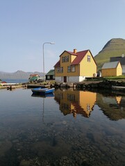 Fototapeta premium The cute and cozy old historical houses of the Faroe Islands with grass on the roof