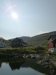 The cute and cozy old historical houses of the Faroe Islands with grass on the roof