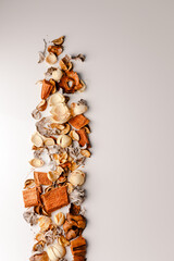 Christmas composition. White little Scandinavian dutch candle houses. Gifts, fir tree branches, red decorations on white background. Christmas, winter, new year concept. Flat lay, top view, copy space