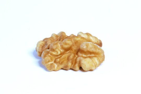 Walnut kernel, without shell, close-up on a white background.