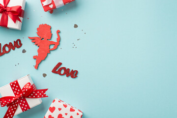 Fototapeta premium Top view photo of st valentine's day decorations gift boxes heart shaped confetti sequins inscriptions love and red cupid silhouette on isolated pastel blue background with copyspace