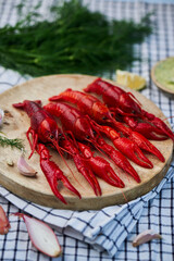 River Cooked Red Crawfish. Boiled crayfish with dill on wooden background