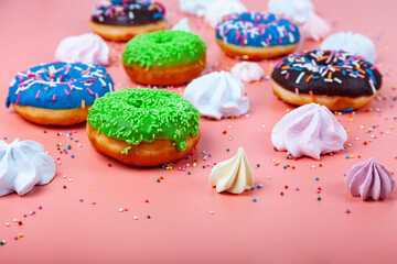 Delicious multicolored donuts and meringues