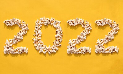 2022 Written with Popcorn on Yellow Background, Creative Photo of Happy New Year 2022, Perfect for Wallpaper