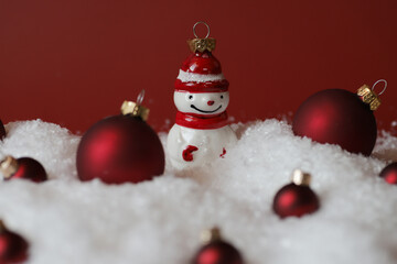 Fototapeta na wymiar Red balls and snowman toy for Christmas and New Year.