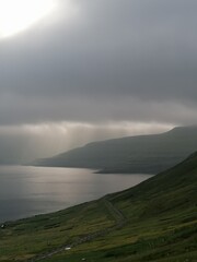 Stunning mountain views in the green and lush hills of the Faroe Islands in the Atlantic Sea