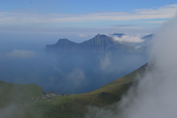 The view from the green mountains over the Faroe Islands and the Atlantic Sea
