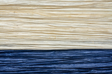 Fototapeta premium background and texture of Thai pleated Unryu mulberry paper, lightweight, soft, translucent and vibrant - navy blue and natural