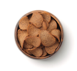 Top view of rye bread chips in wooden bowl