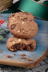 Close up of sliced and whole cookies of chocolate, nuts and hazelnut.