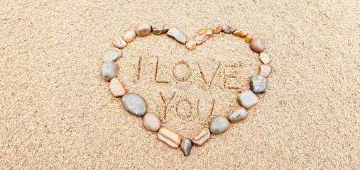 eart made of pebbles in the sand