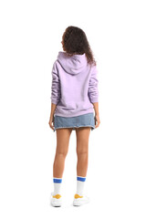 Beautiful young African-American woman in stylish hoodie on white background, back view