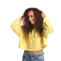 Beautiful young African-American woman in stylish hoodie on white background