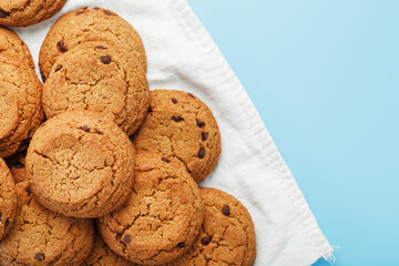 Oatmeal cookies on a napkin on a blue background