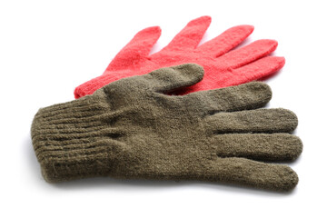 Different warm gloves isolated on white background, closeup