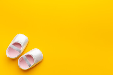 Baby girl pink newborn booties - babyshower party background