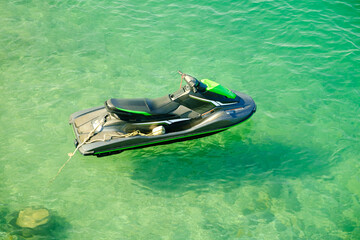 Jet ski on the background of green sea water