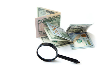 Magnifier and paper money isolated on white background. Concept of keeping money, investing