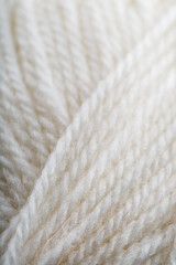 White wool yarn close-up in full screen