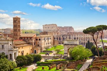 Fototapeta premium Roman forum ancient ruins and Colosseum in Rome, Italy